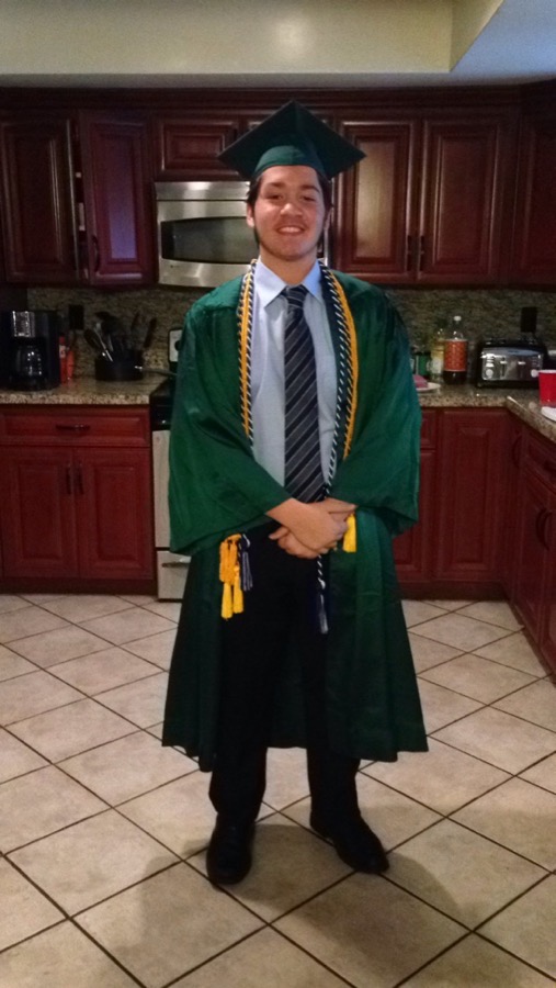 Matt at his graduation, shy and awkward